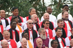 Bishop Alan, second row down, second from right, joins in the singing as the 650 Bishops await their photograph.